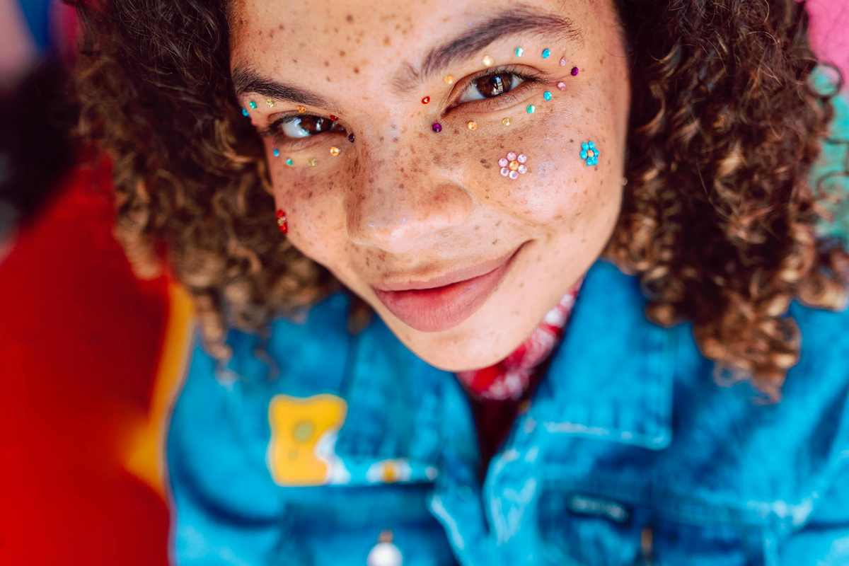 A futuristic close-up of human skin where advanced, translucent microneedle patches precisely deliver compounds, surrounded by elegant holographic projections of real-time biometric data and glowing digital pathways, representing personalized skincare driven by AI.