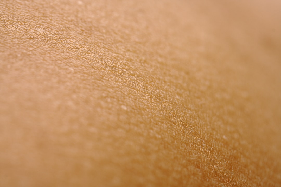 A translucent human silhouette with a vibrant, glowing internal network originating from the gut microbiome, visibly radiating nourishment and health to the skin and hair, set against a dark, microscopic backdrop of swirling beneficial bacteria.