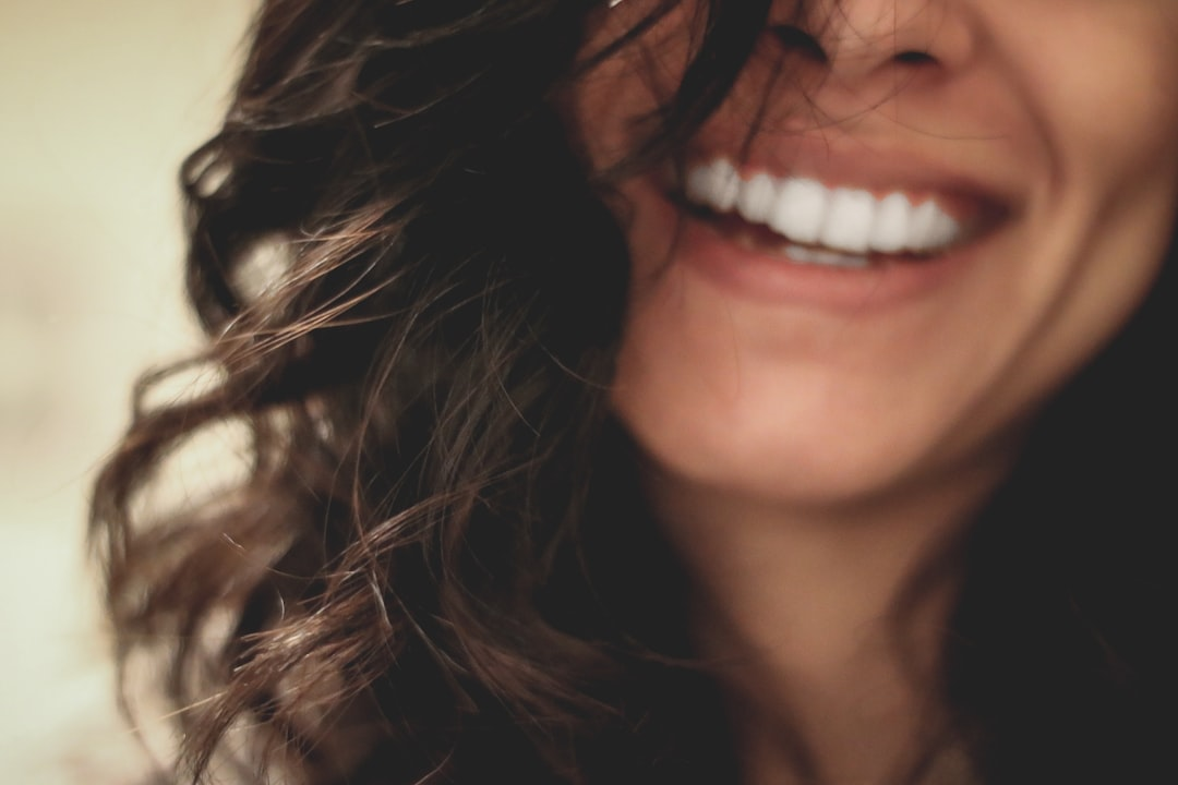 A radiant, close-up of healthy skin and flowing hair, subtly interwoven with luminous, bio-digital patterns representing cellular regeneration and scientific precision.