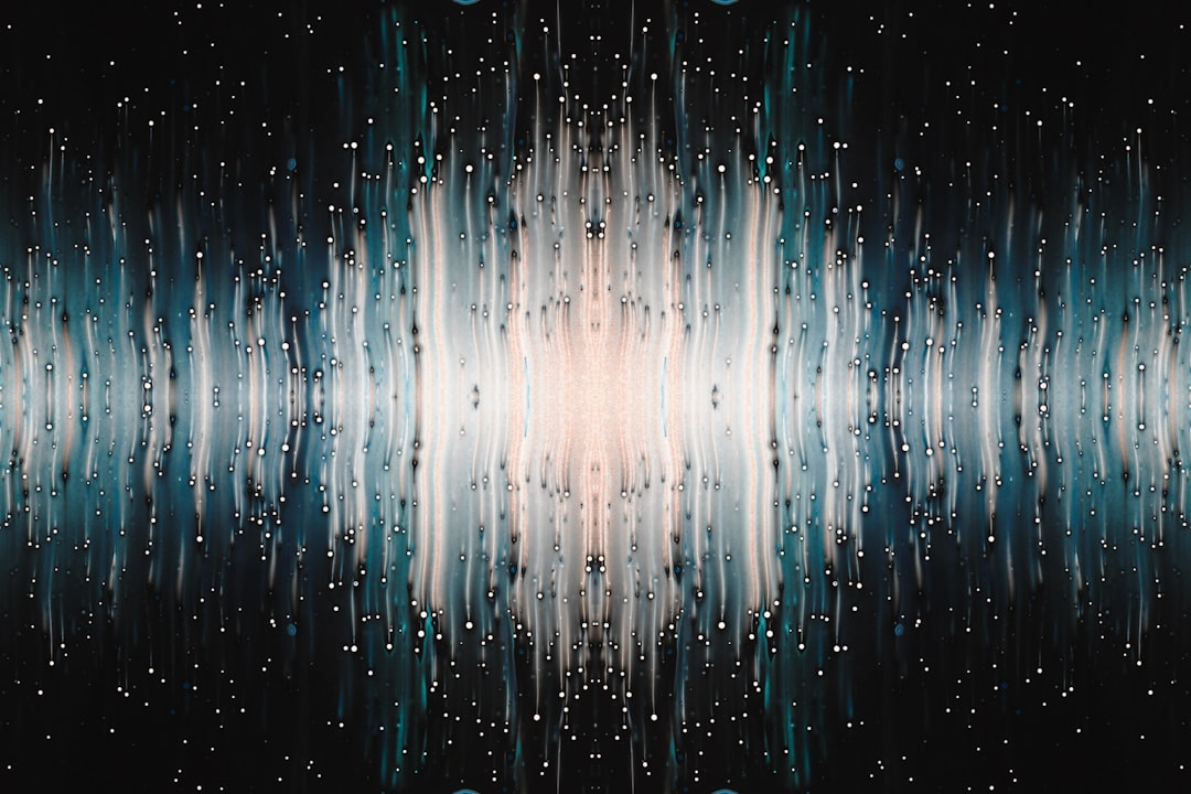 A human head silhouette, with dynamic, glowing brainwave patterns emanating, visually shaped by sound waves or light pulses radiating from modern, minimalist headphones.