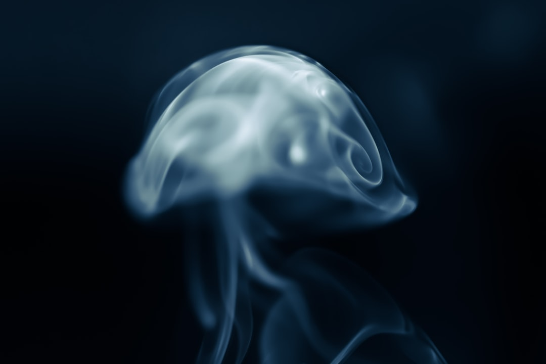 A person meditating calmly with eyes closed, wearing a sleek, minimalist wearable device on their wrist, from which subtle, ethereal glowing lines representing physiological data like Heart Rate Variability (HRV) gracefully emanate, illustrating the integration of technology for enhanced self-awareness and practice.