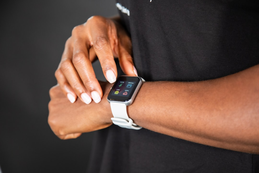 A dynamic shot of an athlete on a lab treadmill, wearing a VO2 max mask, with an overlay of a digital graph displaying peak oxygen consumption, and a smartwatch visible on their wrist, symbolizing comprehensive functional and physical assessment.