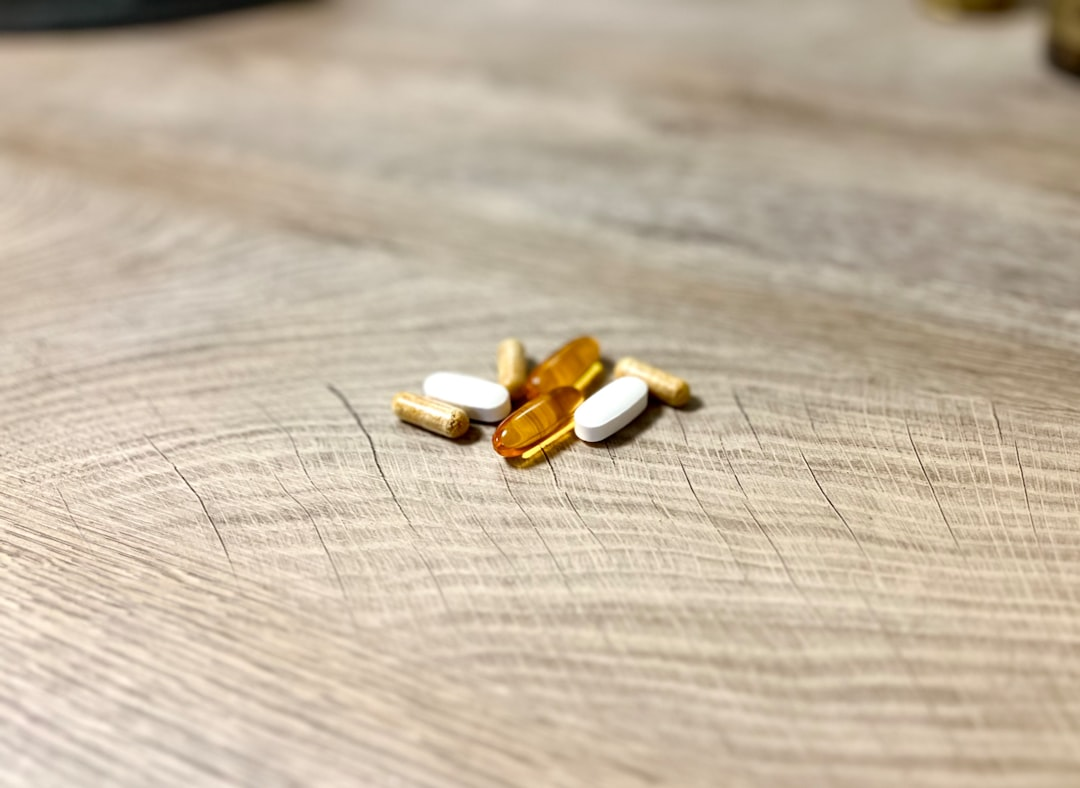 A cluster of vital supplement capsules (Magnesium, Zinc, Vitamin D) emit subtle, glowing energy pathways that intricately connect with and activate a vibrant, abstract representation of the human endocrine system, symbolizing profound hormonal balance and enhanced vitality.