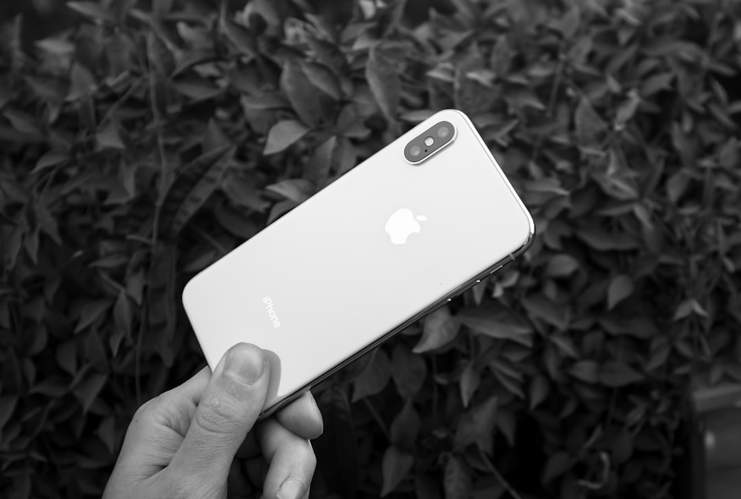 A close-up of a human eye, subtly reflecting the blue light from a digital screen, featuring intricate, faint bio-luminescent pathways within that appear stressed and dimming, symbolizing the fatigue and decline of cellular power plants (mitochondria) due to modern lifestyle and environmental demands.