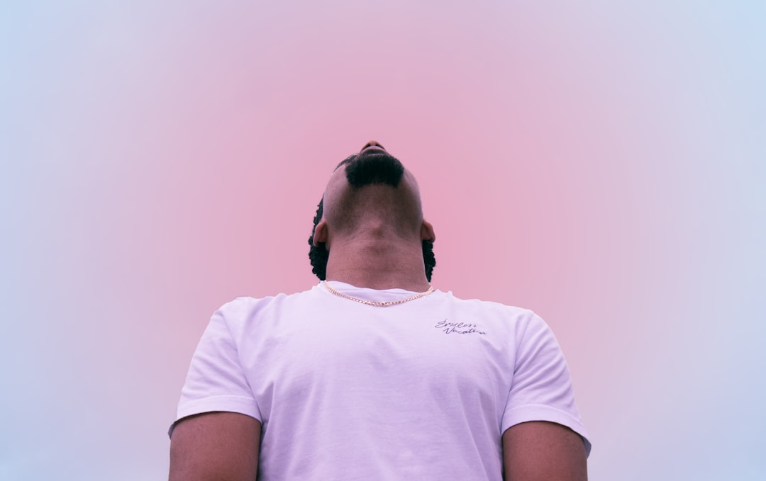 A peaceful figure deeply sleeping in a cool, pitch-black room, with their body subtly integrated into a luminous, architectural pillar that glows with serene energy, symbolizing sleep as the foundational element for optimal hormone health.