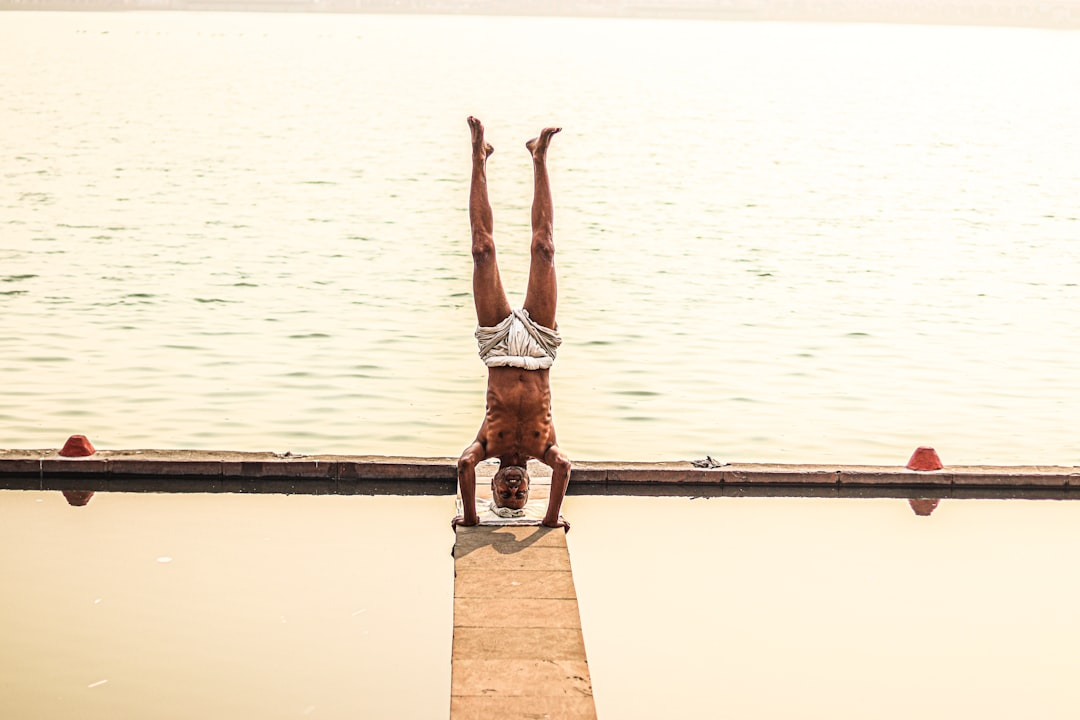 A futuristic, translucent human figure revealing an intricately glowing internal engine representing mitochondria, being precisely fueled by vibrant, luminous streams of diverse micronutrients and targeted supplements.