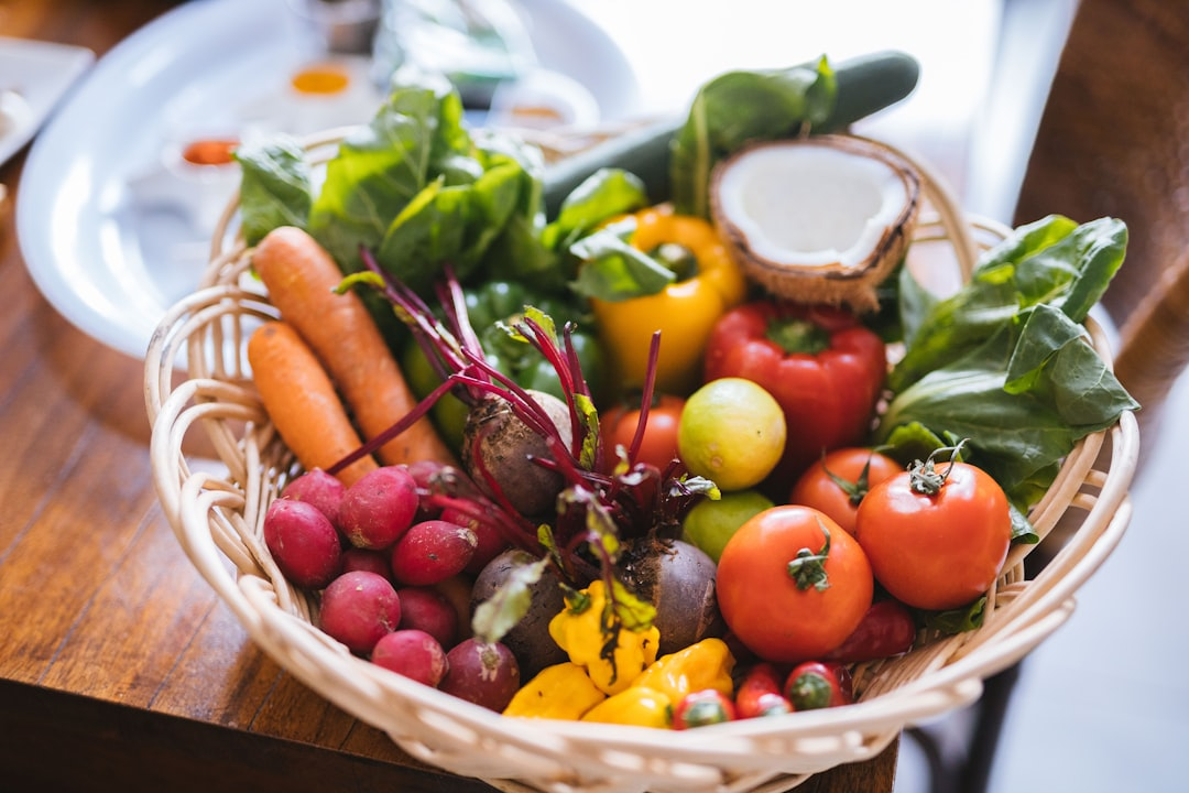 A stylized human torso subtly integrated with an abundant, vibrant 'inner garden' composed of diverse whole plant-based foods like colorful fruits, vegetables, and grains, illustrating nutrition as the primary foundation for a thriving gut microbiome.