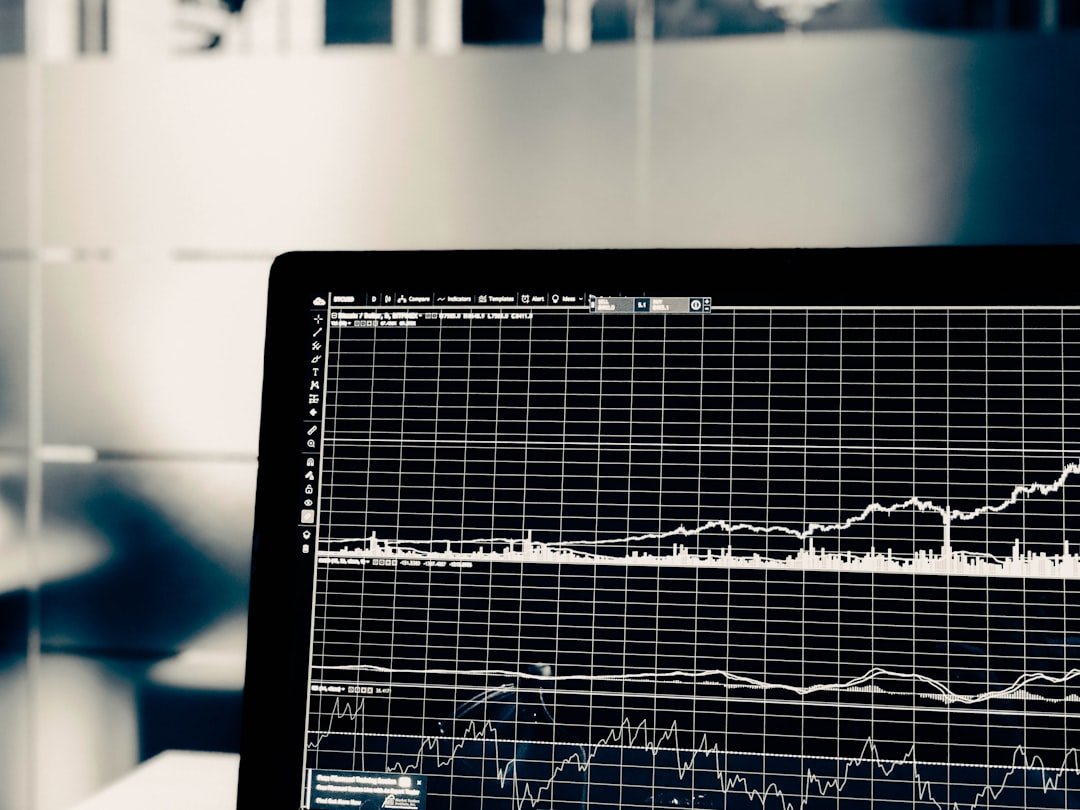 A high-angle, minimalist scene on a modern desk: an open guidebook with clear diagrams beside a glowing tablet displaying a steep, upward-trending growth chart, surrounded by sleek, efficiency-focused tools, illuminated by crisp, directional light.