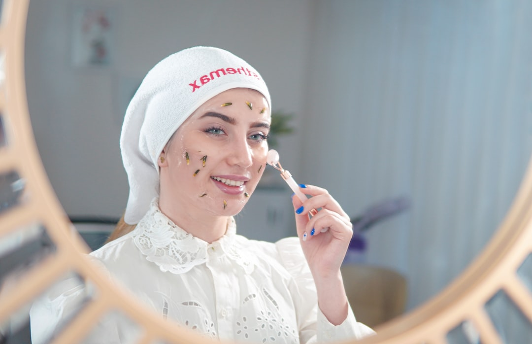 A detailed cross-section of skin revealing warm, subtle radiofrequency waves penetrating the dermis, where existing collagen fibers appear visibly tightened and new, vibrant collagen strands are depicted forming and glowing.