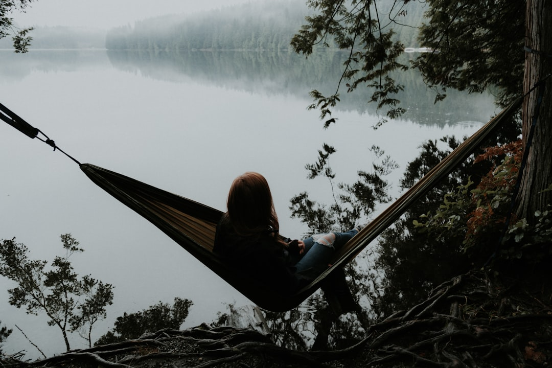 A person in peaceful sleep, their form subtly integrated with illuminated, flowing metabolic pathways and a gentle, oscillating circadian light pulse, illustrating biohacker-optimized physiological harmony.