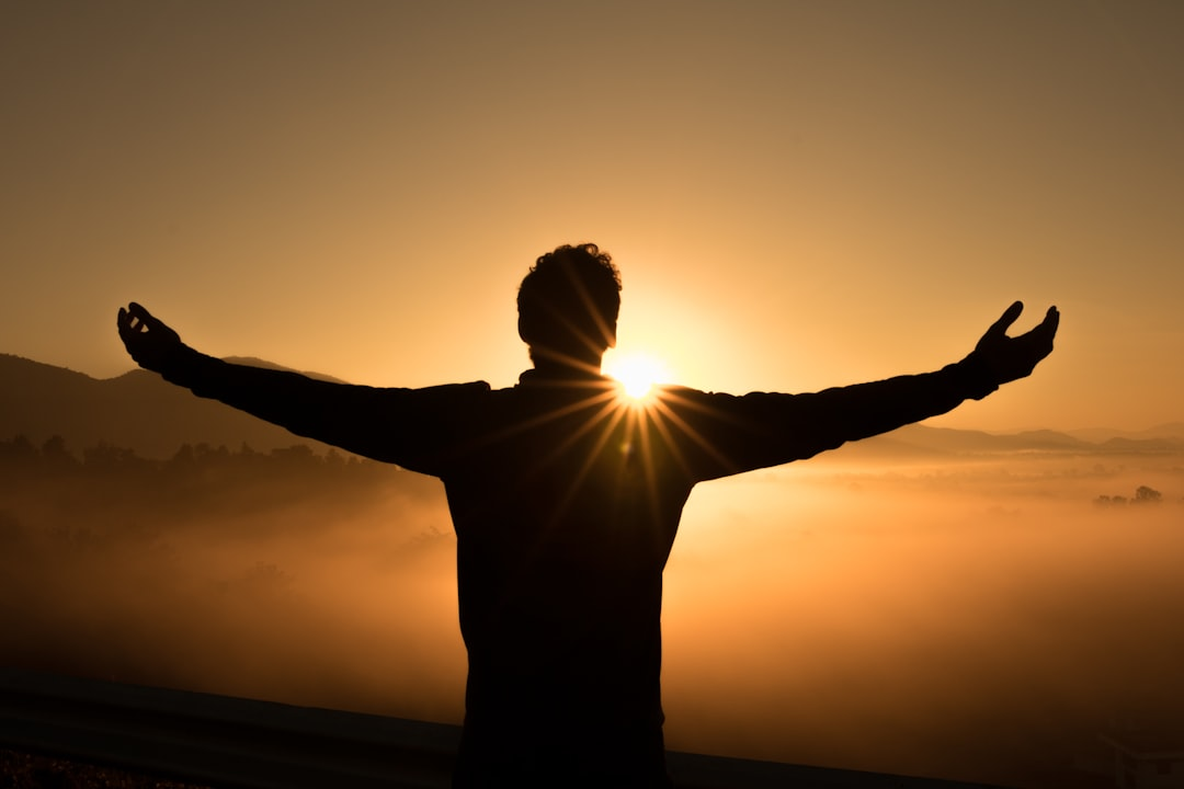 A vibrant, thriving human body formed from and rooted in a rich, fertile landscape of diverse whole foods (organic meats, colorful vegetables, healthy fats), with a subtle golden aura emanating from a few artfully placed supplement capsules, signifying amplified health and hormonal balance.