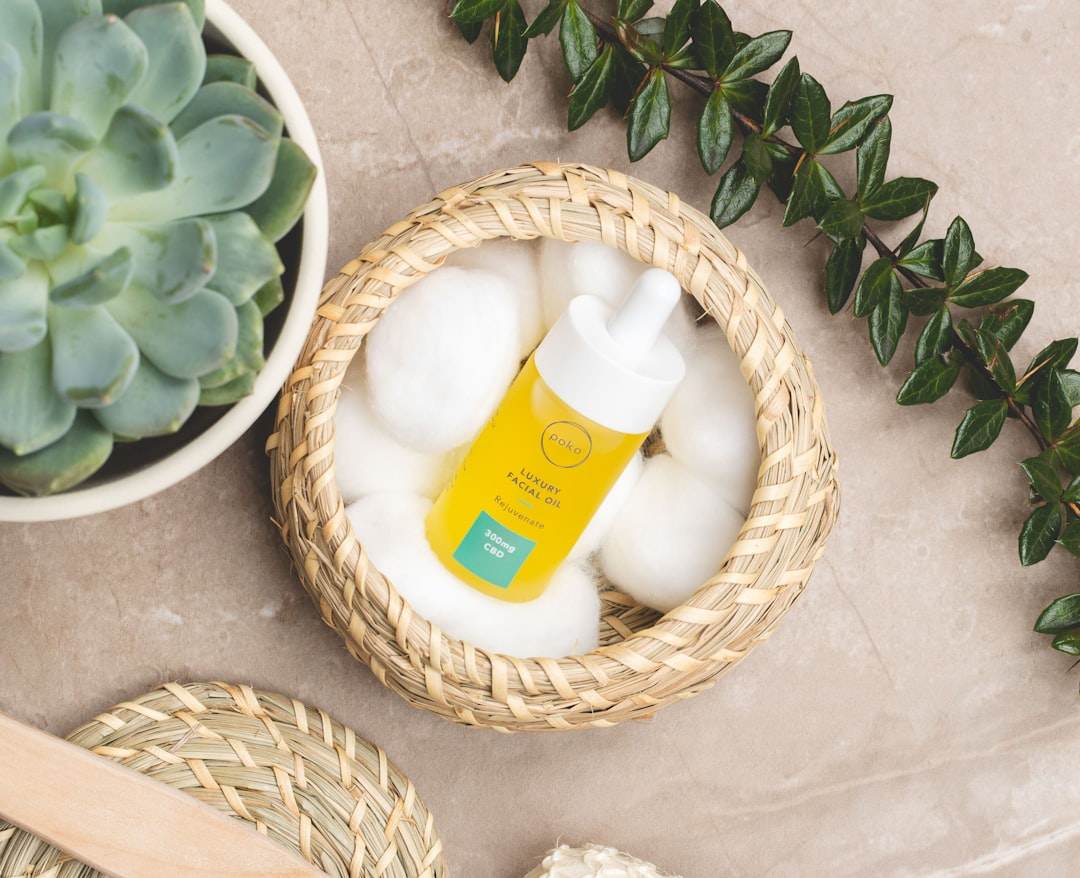 A magnified, radiant cross-section of healthy skin cells, where glowing, vibrant mitochondria emit light that illuminates the surrounding collagen and elastin fibers, subtly enhancing the skin's visible luminosity and firmness.