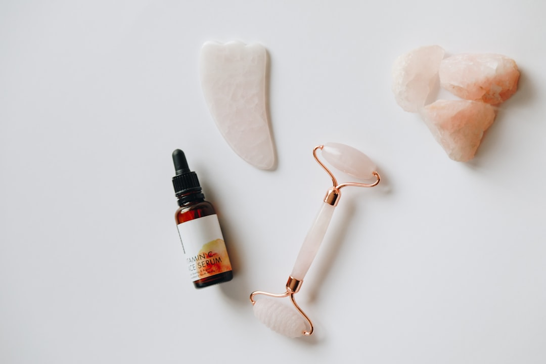 A close-up of healthy, radiant skin and hair strands, subtly enveloped by a shimmering, protective barrier that visually deflects stylized environmental stressors like sun rays, pollution particles, and digital blue light, as a single, precise drop of a nourishing serum is absorbed into the surface.