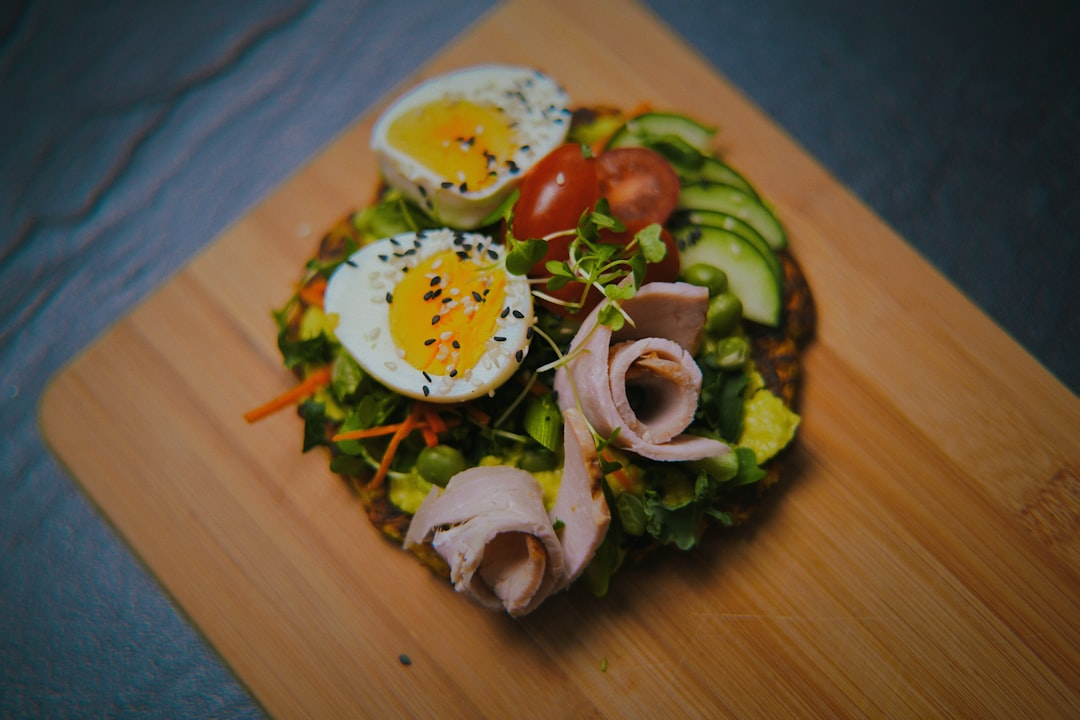 A vibrant, artfully arranged plate of nutrient-dense, whole foods, with subtle, glowing digital interface elements superimposed, illustrating advanced dietary protocols precisely engineered for extended healthspan.