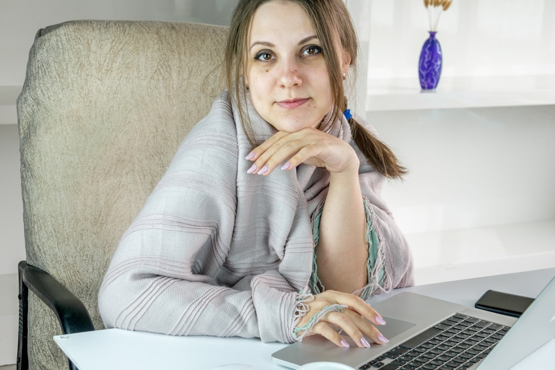 A solitary figure navigates a winding, dimly lit labyrinth constructed from stacked, inconclusive medical charts and 'normal' blood test results, while a network of subtle, bioluminescent pathways glows faintly beneath the floor, representing hidden root causes of chronic fatigue.