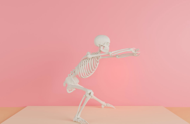 White anatomical skeleton model performing a deep squat or lunge with arms extended forward, set against a vibrant pink backdrop and beige floor, illustrating the benefits of exercise for healthy movement and gut function.
