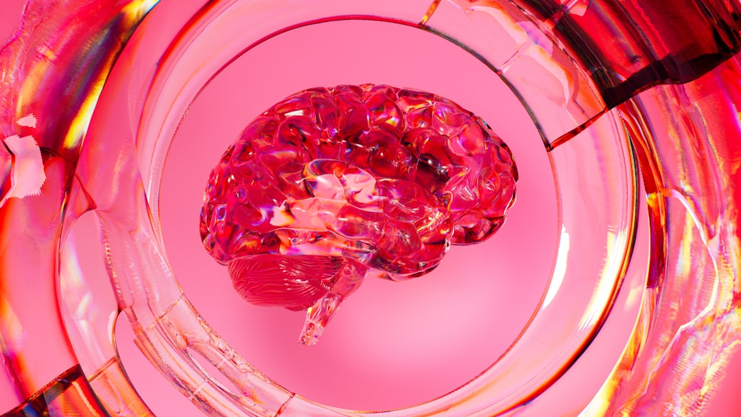 Glowing, translucent pink brain encircled by dynamic, reflective glass swirls on a vibrant fuchsia backdrop, symbolizing enhanced cognitive function and brain optimization.